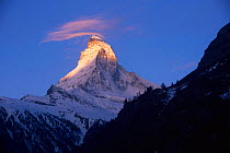 Sun hitting the peak and upper slopes of Matterhorn mountain, Switzerland