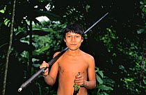 Young Quichua Indian with blow gun and dead Maroon tailed parakeet prey, Ecuadorian Amazon