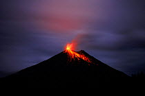 Lava flows from errupting Arenal volcano at night. Costa Rica