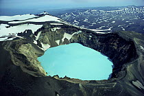 Aerial view looking down into blue sulphuric / hydrochloric lake in volcanic crater, Kamchatka, Russia