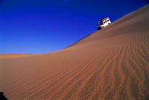 Landrover crossing sand dunes, Skeleton Coast, Namibia