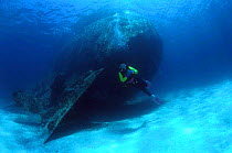 Diver at rear end of shipwreck, Cuba, Caribbean