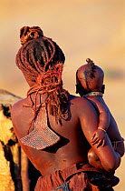 Himba woman & child, traditional dress. Kaokoland Namibia 1999.