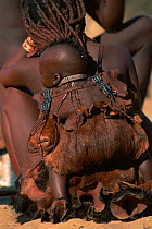 Himba woman & child, traditional dress. Kaokoland Namibia 1999.