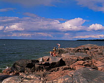 Family enjoying summer holiday on lake shore, Varnen, Sweden