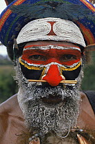 Huli man with painted face, at sing-sing nr. Mount Hagen, Papua New Guinea. Traditional dress 1991.