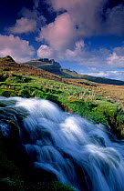 Trotternish waterfall and Old Man of Storr, Isle of Skye, Scotland.