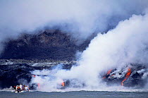 People in zodiak observing volcanic eruption, Cabo Hammond, Fernandina Island, Galapagos, March 1995.