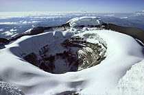 Aerial view of Cotopaxi volcano crater in snow, Ecuador