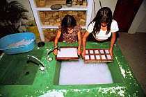 Paper recycling project, children making new paper, Pro Pueblo Foundation, La Entrada, Ecuador
