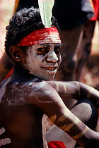 Aboriginal boy waits to perform in traditional dress. Australia
