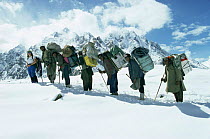 Mandy Dickinson with porters climbing in Karakoram Himalayas range, Pakistan, 1994