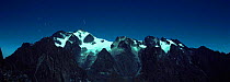 Panoramic peaks of Mount Stanley at night, long exposure showing star movement, Ruwenzori "Mountains of the Moon" Virunga NP, Democratic Republic of Congo (formerly Zaire)