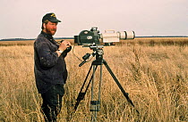 Cameraman Jeff Turner on lookout for wolves, Wood Buffalo NP, Canada, 1996