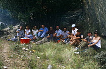 David Attenborough, shepherds & crew sharing picnic lunch on location for BBC programme "The First Eden", Soria, Spain, June 1986