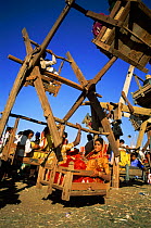 Rustic wooden ferris wheel at the fair, Central India