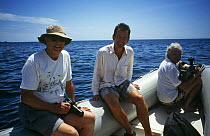 David Attenborough, Martin Saunders and Nigel Marven in boat, Galapagos Islands, on location for filming for BBC Life of Birds 1997