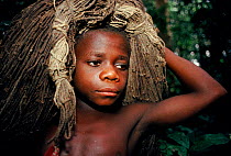 Bambuti pygmy boy with net made from plant fibres. Epulu Ituri Reserve, DR Congo (formerly Zaire)