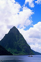 Sail boat in coastal waters infront of Petit Piton Mountain, Soufriere, St Lucia, Caribbean