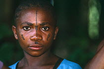 Bambuti pygmy portrait with face painting using charcoal and plant juice, Democratic Republic of Congo
