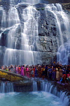 Pilgrims bathe in Courtallam Falls at start of monsoon, southwest Ghats, Tamil Nadu, India