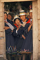 Quechua girls watch wedding ceremony, Bolivia