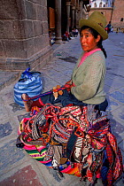 Woman spinning in Cuzco handicraft market, Peru