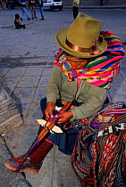 Woman spinning in  Cuzco handicraft market, Peru