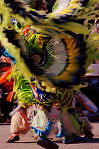Native American in feather costume at Pow Wow dance. Wisconsin, USA