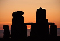 Sun setting at Stonehenge, Wiltshire, England. UK, Europe.