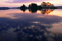 Sunrise over water at Turtle Flambeau Flowage (result of 1926 construction of dam to create reservoir) Wisconsin, USA