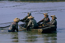 Chinese fisherwomen in sampan, Mai Po, China.