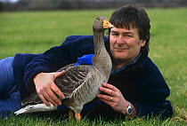 Producer John Downer with Goose, fitted with specially adapted video camera 'goosecam' for filming during flight. BBC series "Supernatural", 1999