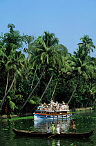 Allepy backwaters with tourists on sightseeing boat Kerala, Southern India