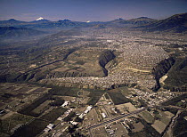Aerial view of Quito, the capital of Ecuador, with snow-capped volcanoes in the background