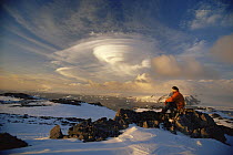 Person observing lenticular cloud formation over Signy Island, South Orkneys, Antarctica