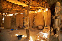 Interior of Dogon house with wooden carvings of women, Mali, North Africa
