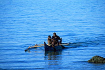 Local people in outrigger canoe, Nosy Komba Island, Madagascar