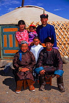 Family group portrait outside their yurt (home), Gobi Desert, Mongolia.