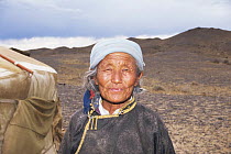 Elderly lady, outside in Gobi Desert, Mongolia.