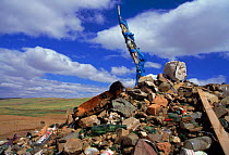 An 'Ovoo', a pile of rocks and natural materials at which offerings are made. Gobi Desert, Mongolia.