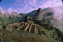 Machu Picchu ruins with Huayna Pichu in background. Peru