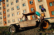 Abandoned vehicle outside Russian Arctic housing estate, Egrekinot, Siberia, Russia