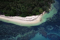Aerial view of island shoreline showing land, sea and coral reef, Seychelles, Indian Ocean