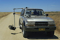 Camera mounted on car for filming locust outbreak for BBC television series Alien Empire, Ivanhoe, Australia. 1994