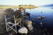 Cameraman Michael Richards with timelapse camera on Lake Bogaria, Kenya, 1994