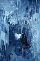 Scientist in ice cave, Signy island, Antarctica
