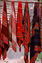 Traditional shawls hanging in Andean village. Peru.