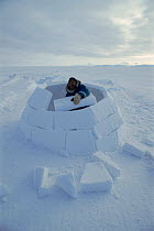 Man making igloo, Admiralty Inlet, Canadian Arctic Sequence (Isaac Shooyuk)
