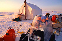 Inuit children at hunter's camp site, Baffin Island, Nunavut, Canada. Nataniel & Goulvan. Model released.